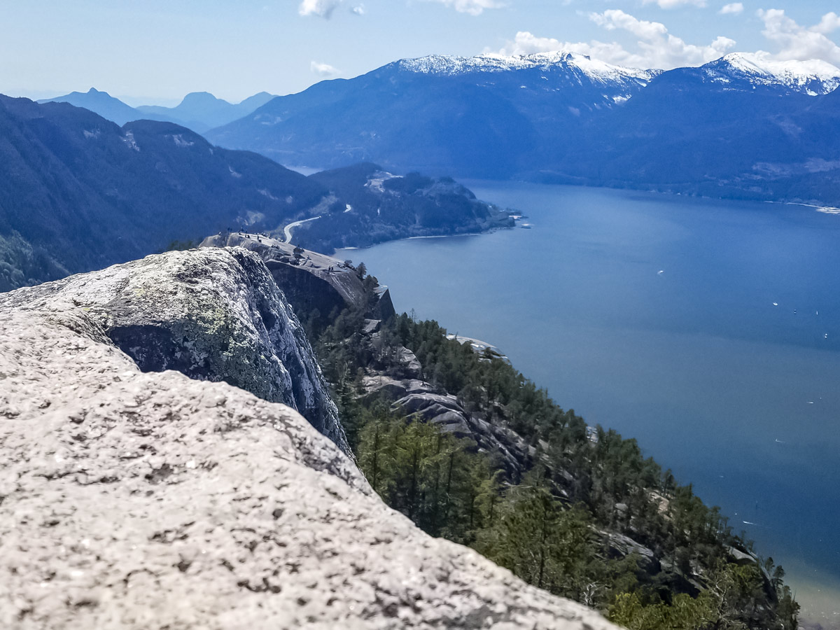 Hikers on far away mountain plateau hiking near vancouver sea to sky