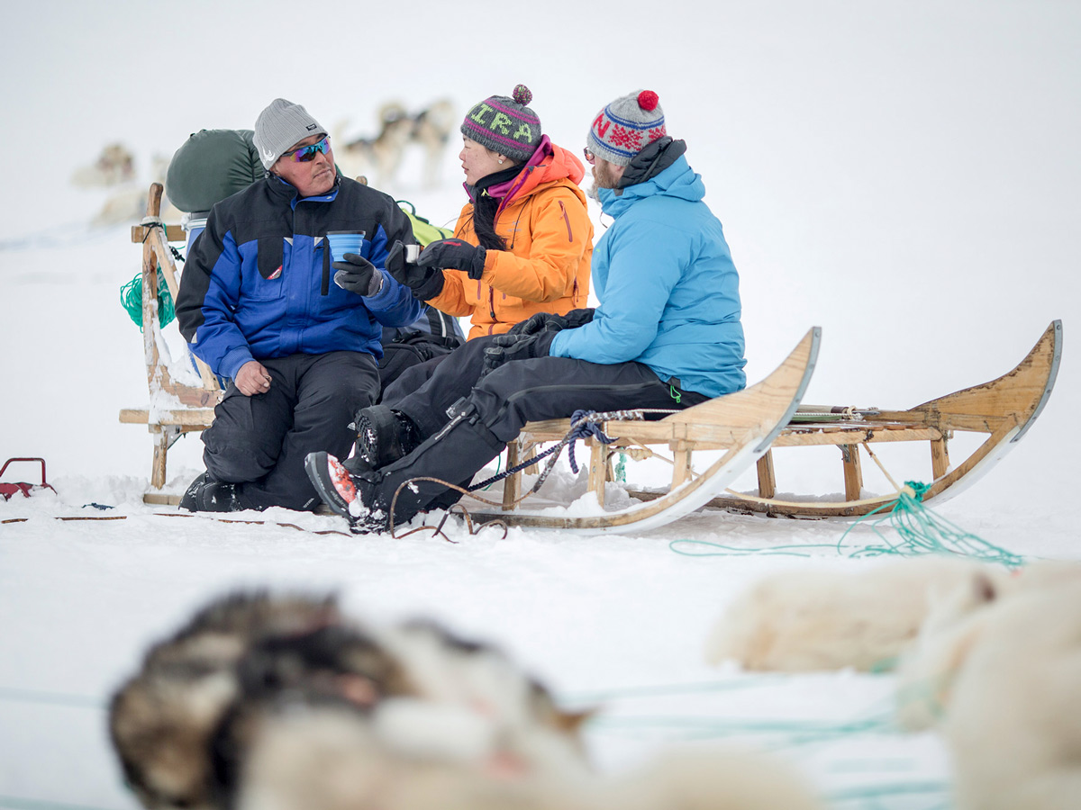 Dog Sledding tour group coffee break in Greenland