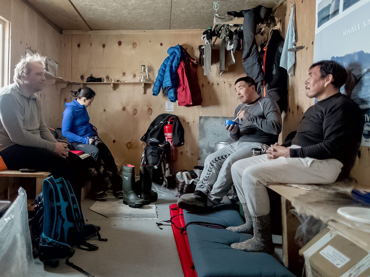 Warming up in cabin along Dog Sledding tour in Greenland
