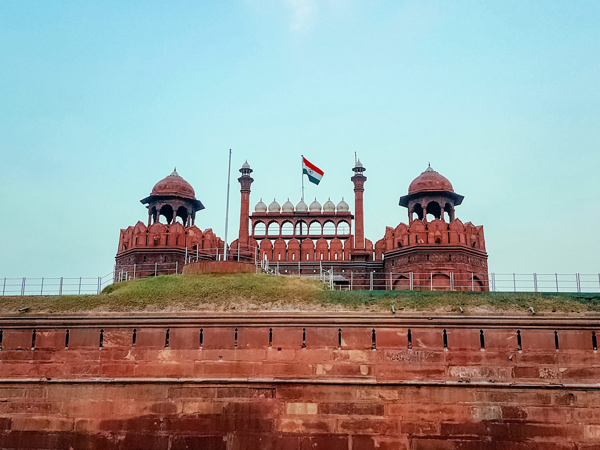 Indian flag flying over Red Fort in Agra India two day adventure tour