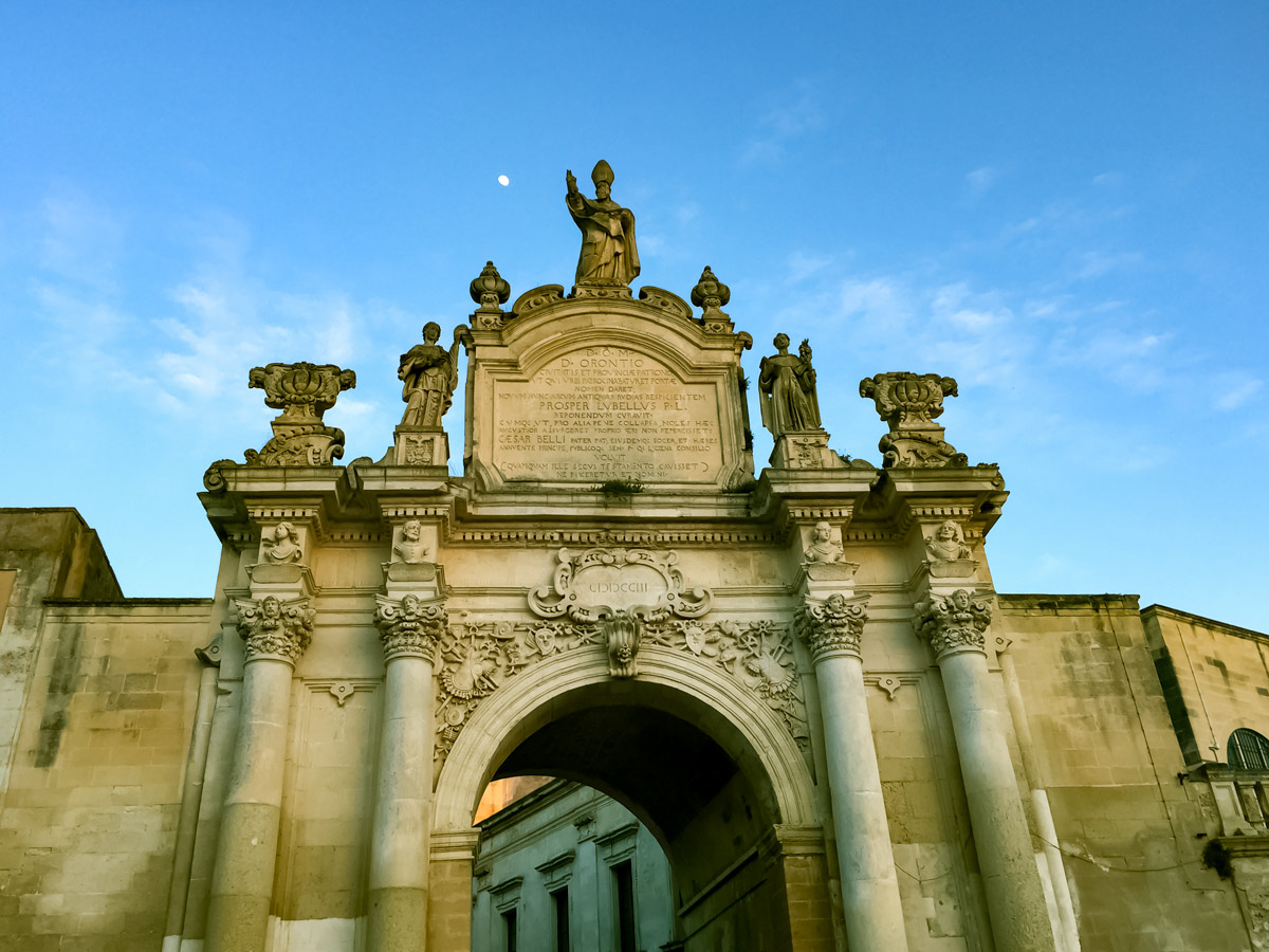 Italian monument plaque archway Lecce along cycling tour Italy