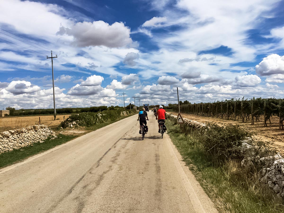Cycling under beautiful blue Puglia sky Italy