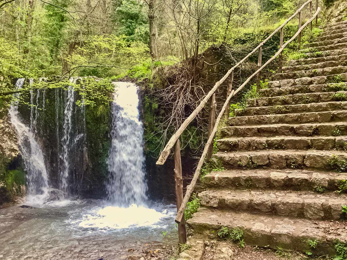 Waterfall and stone stairs in the forest walking Amalfi Coast Italy