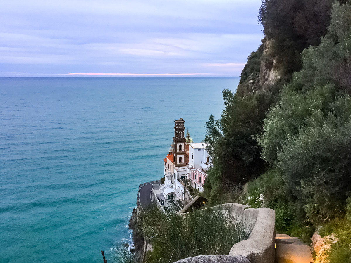 Towerroad buildings on ocean coast walking Amalfi Coast Italy