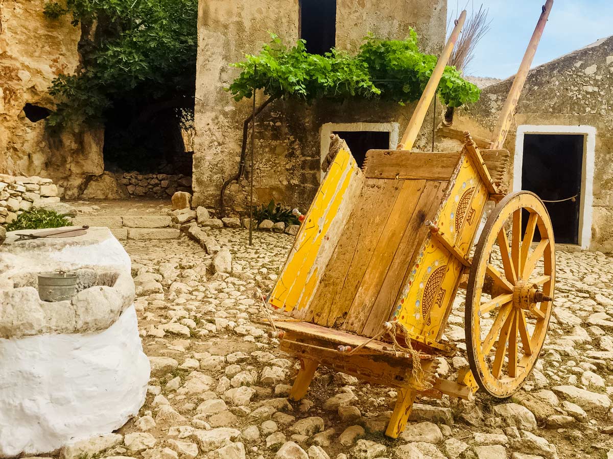 Grotta Mangiapane wheelbarrow yellow Western Sicily Walking Holiday Italy