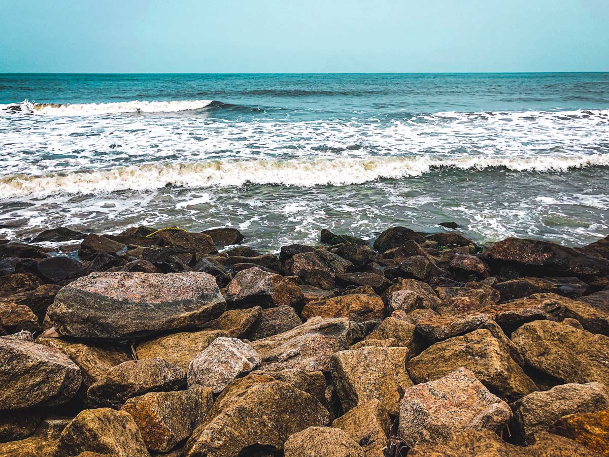 Kerala rocky ocean shore waves along adventure tour India