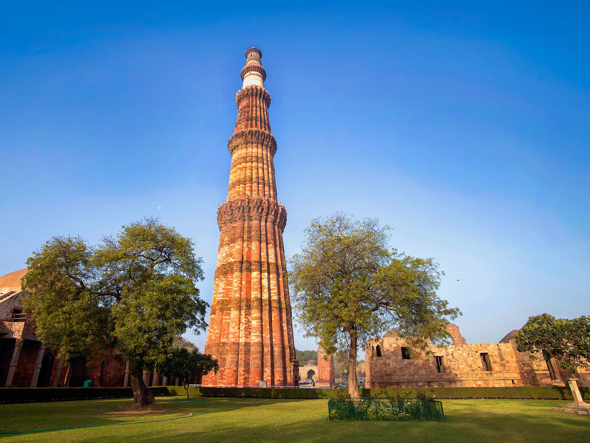 Qutub minar delhi monument pillar on landmark grounds in India