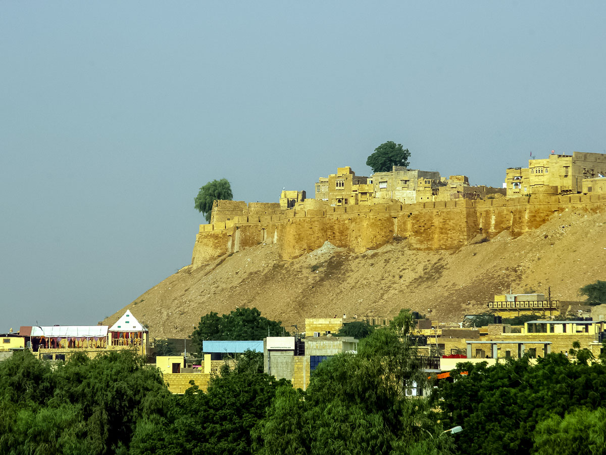 Jaisalmer Fort high on the hill above village in Rajasthan India