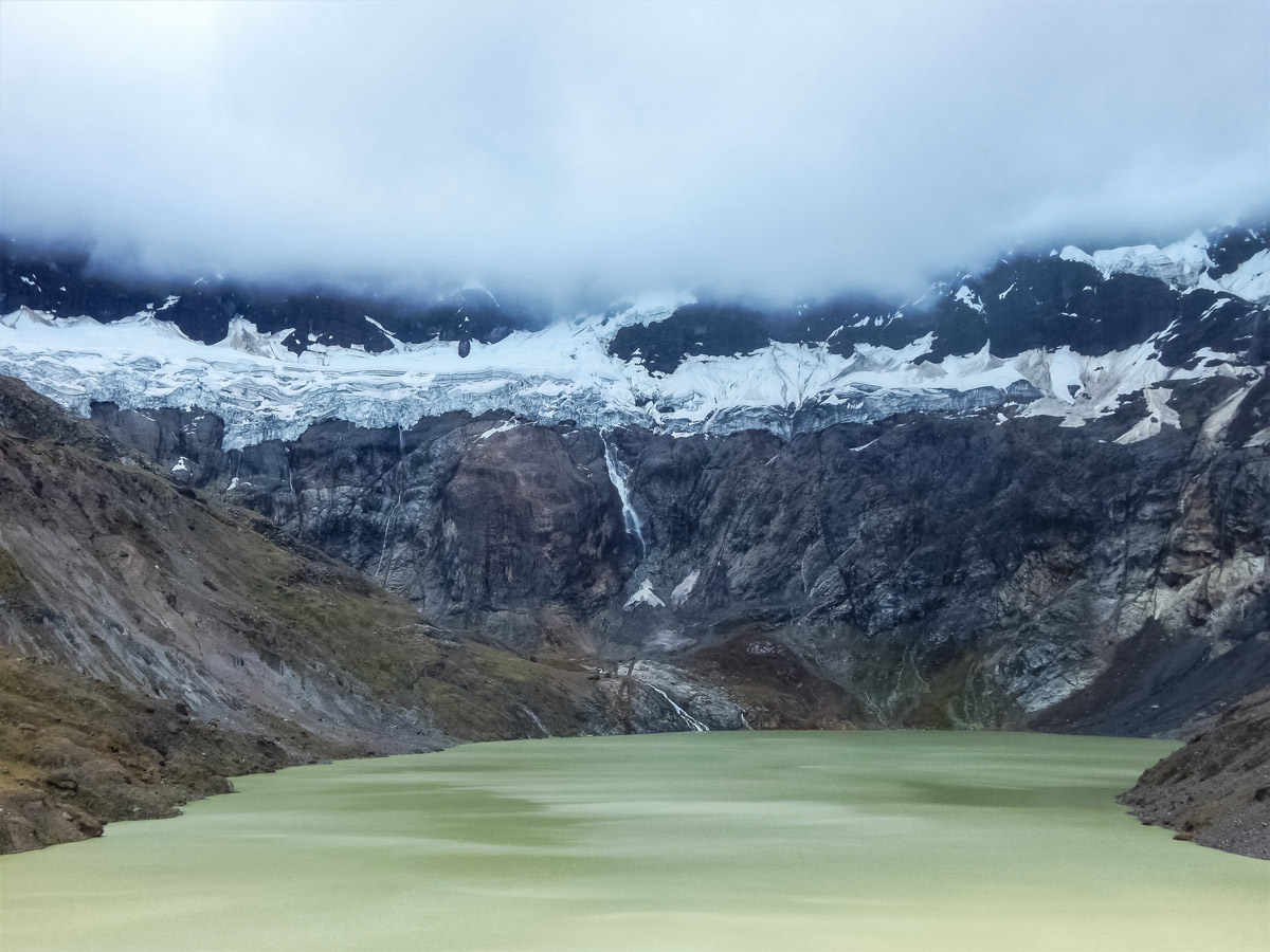 Green lake glacier hiking trekking altar volcano Peru