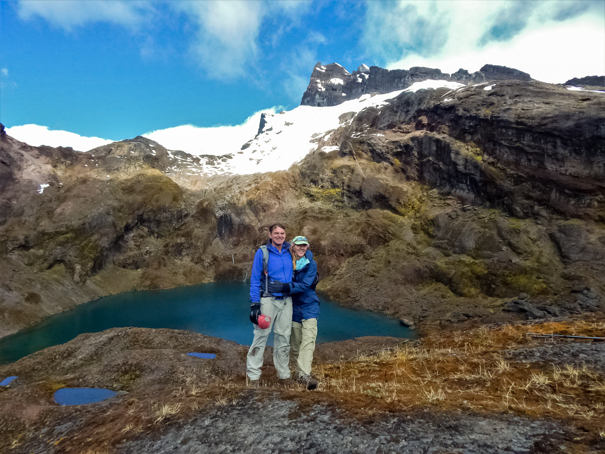 Couple of hikers pose at viewpoint hiking trekking altar volcano Peru