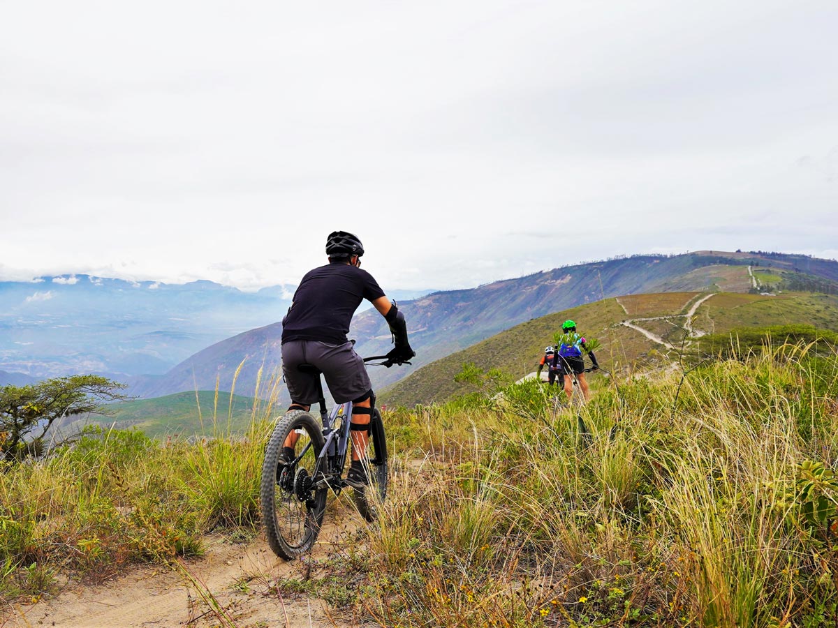 Mountain biking group bike tour in mountains hills Ecuador