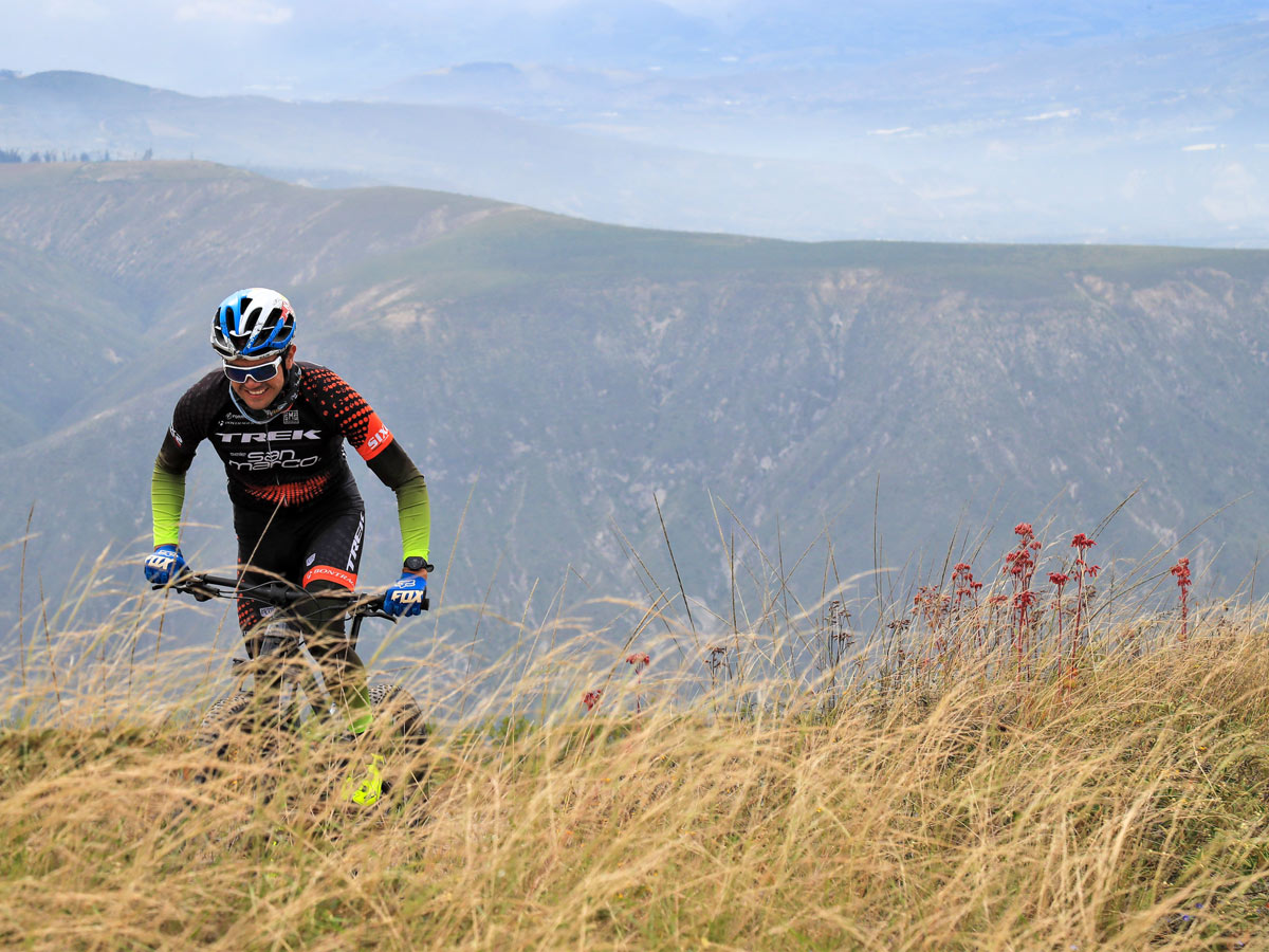 Mountain biker climbing hills bike tour Ecuador