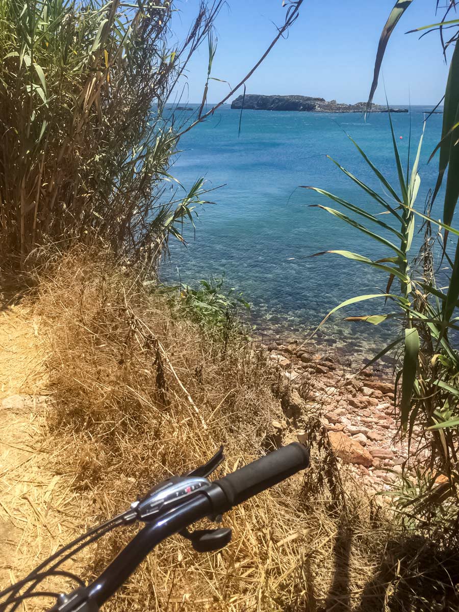 Biking Portugal coastline clear blue sea water