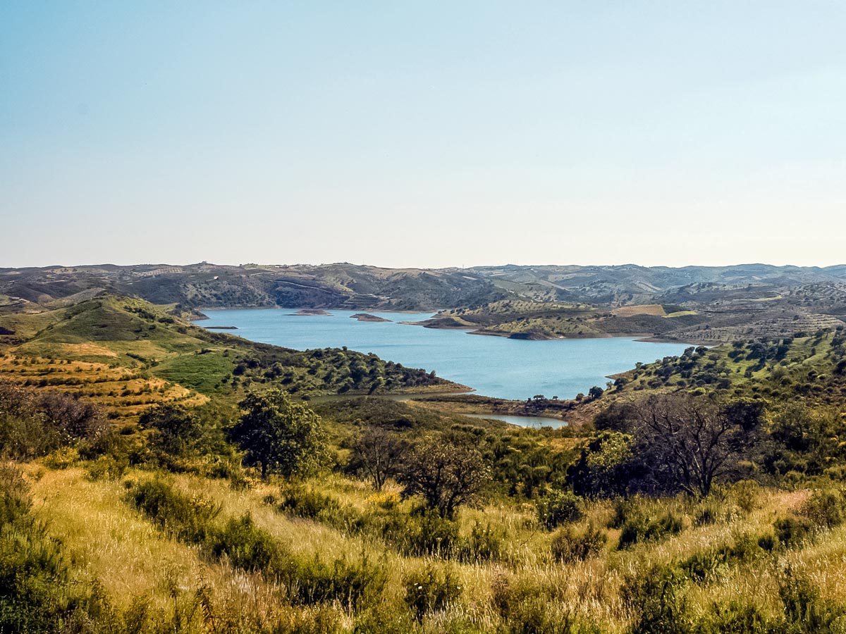 Road biking in Portugal beautiful countryside lake Barragem