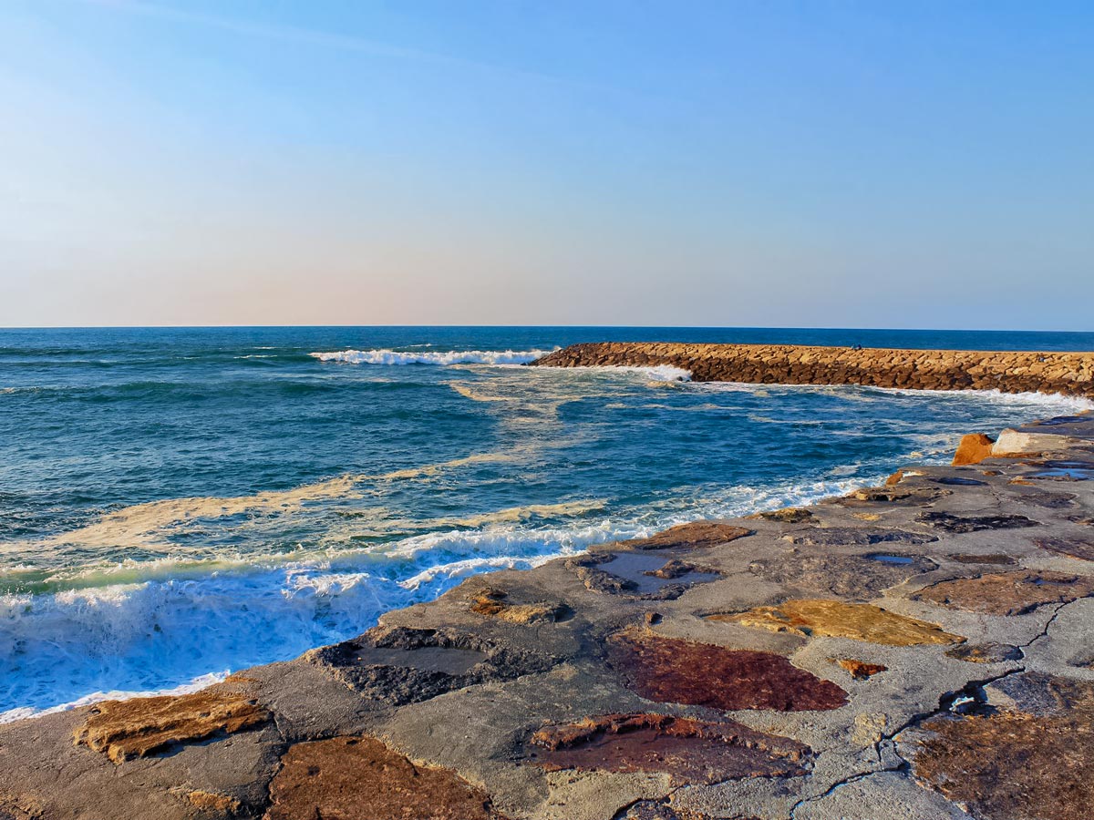 Furadouro Portugal ocean waves on stone retaining walls coastal biking cycling tour