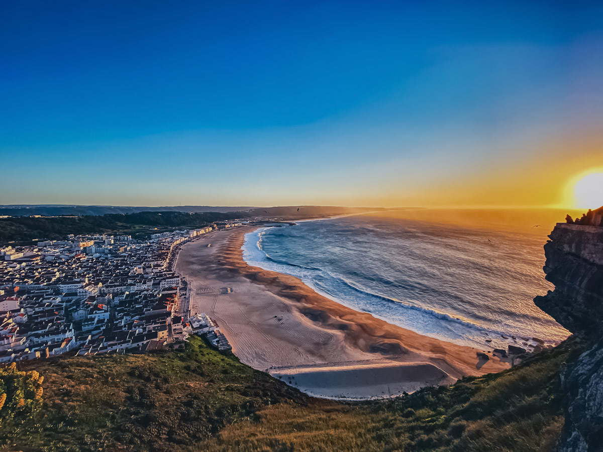 Nazaré Portugal stunning ocean coastal city sunset cycling tour