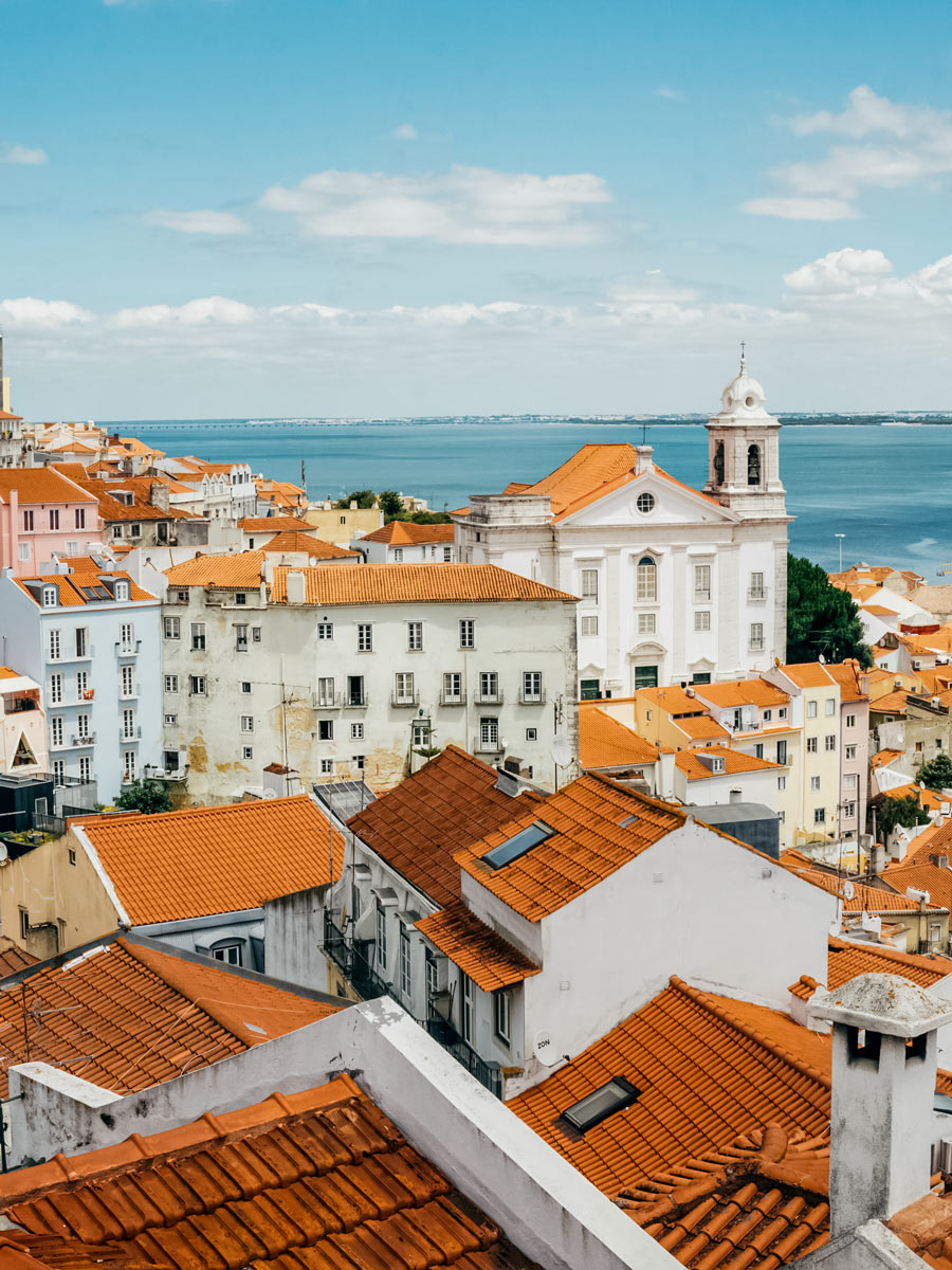 Lisbon orange tile roofs cycling tour Portugal