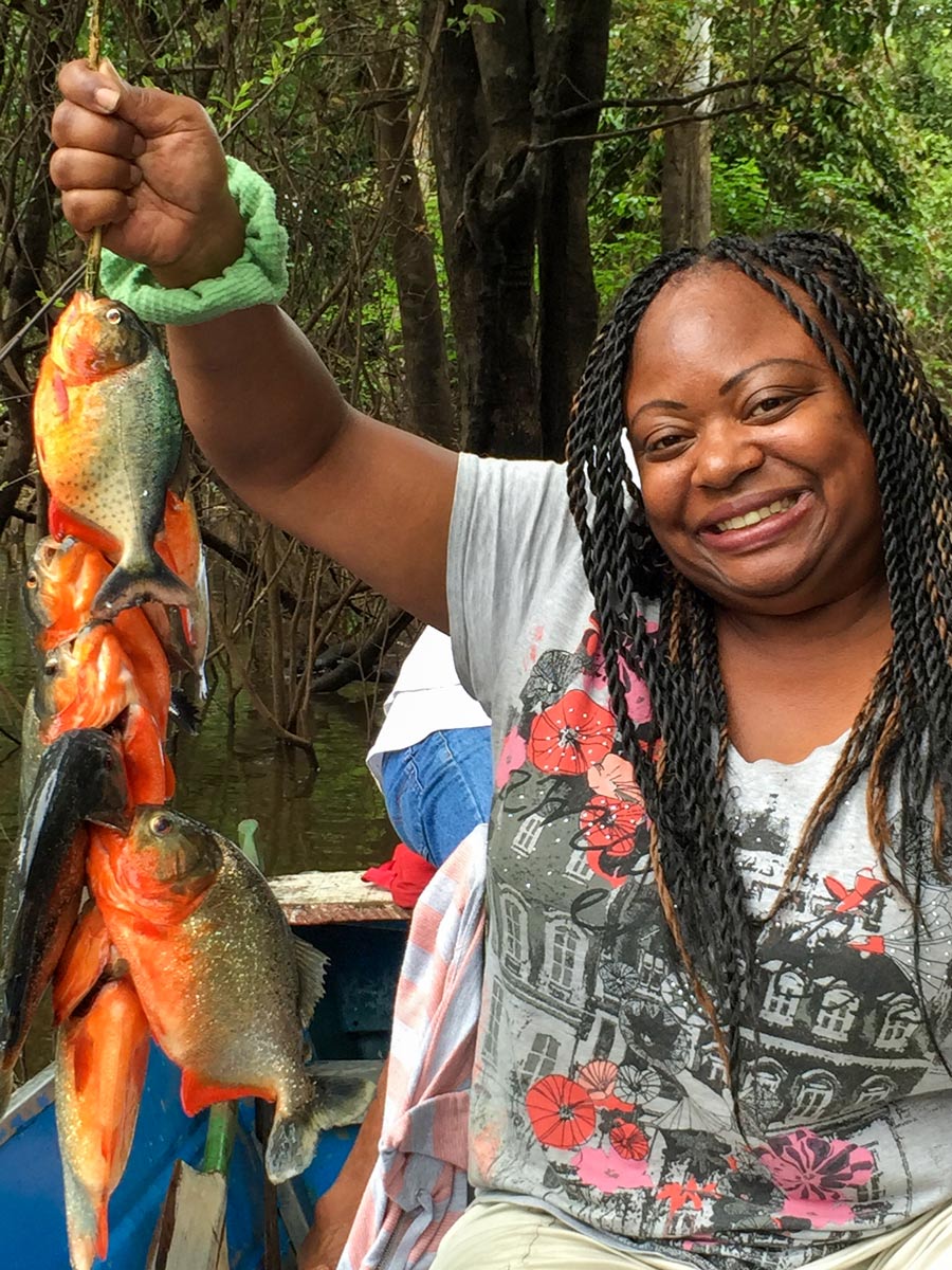 Catching piranha Amazon camping expedition Peru