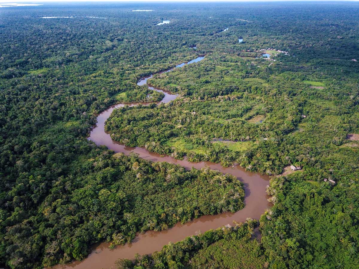 Meandering river in Amazon rainforest fishing expedition Peru