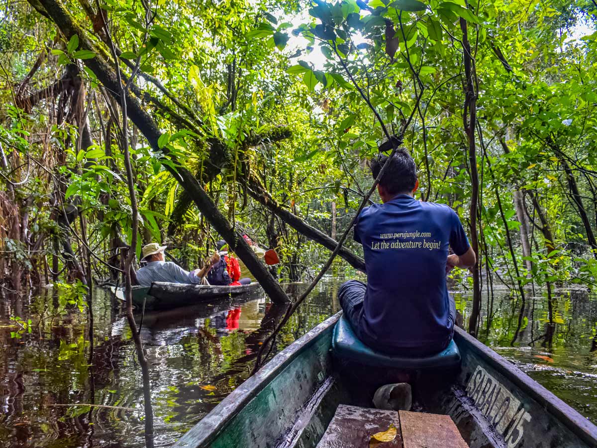 Peruvian Amazonia boats on the river fishing expedition Peru