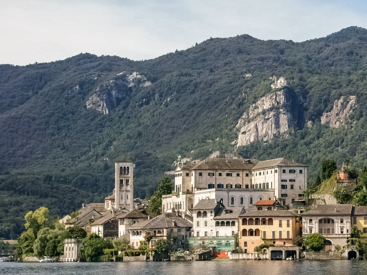 Isola di San Giulio Vista dal lago city on the water mountains biking cycling Italy