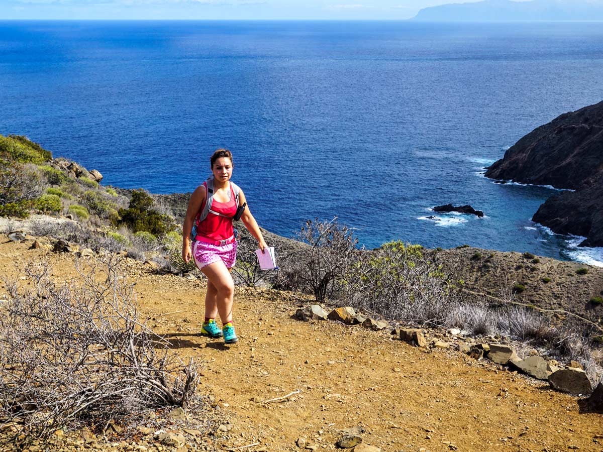 Hiking above the ocean walking adventure tour Spain