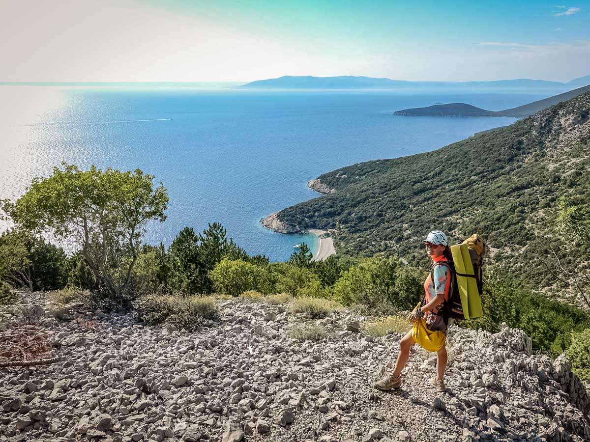 Hiking high above ocean shoreline walking adventure tour in Croatia