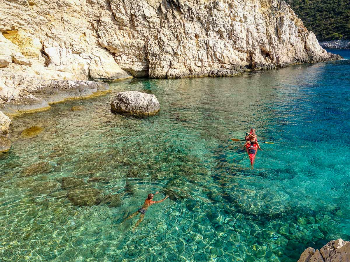 Crystal clear ocean sea waters swimming kayaking hiking walking adventure tour in Croatia