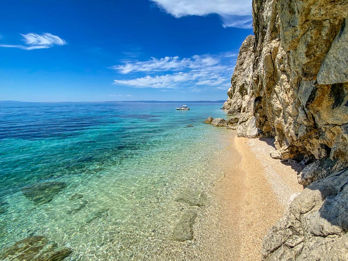 Clear mediterranean sea beach boat walking adventure tour in Croatia