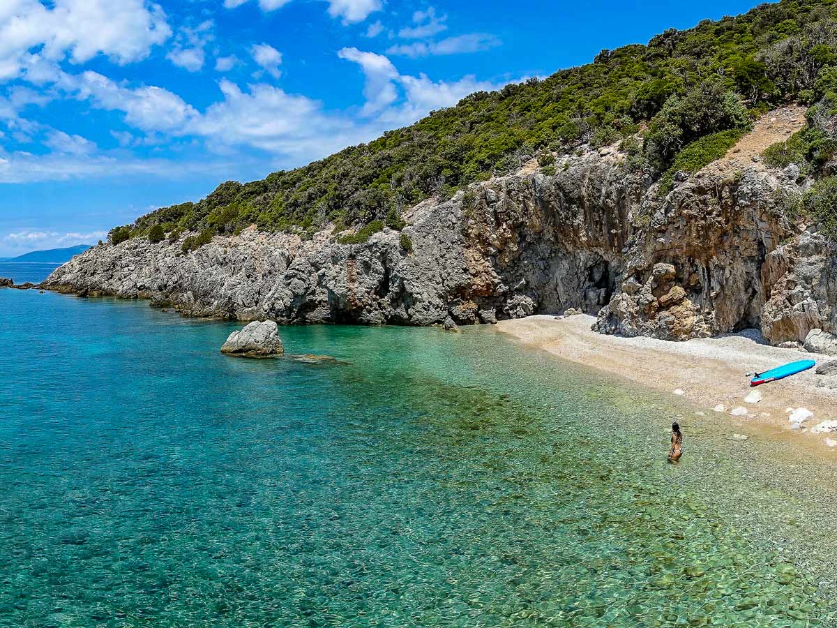 Secluded mediterranean beach swimming paddleboard walking adventure tour in Croatia