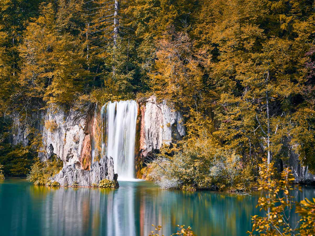 Waterfalls mirrored reflection on water walking adventure tour Croatia