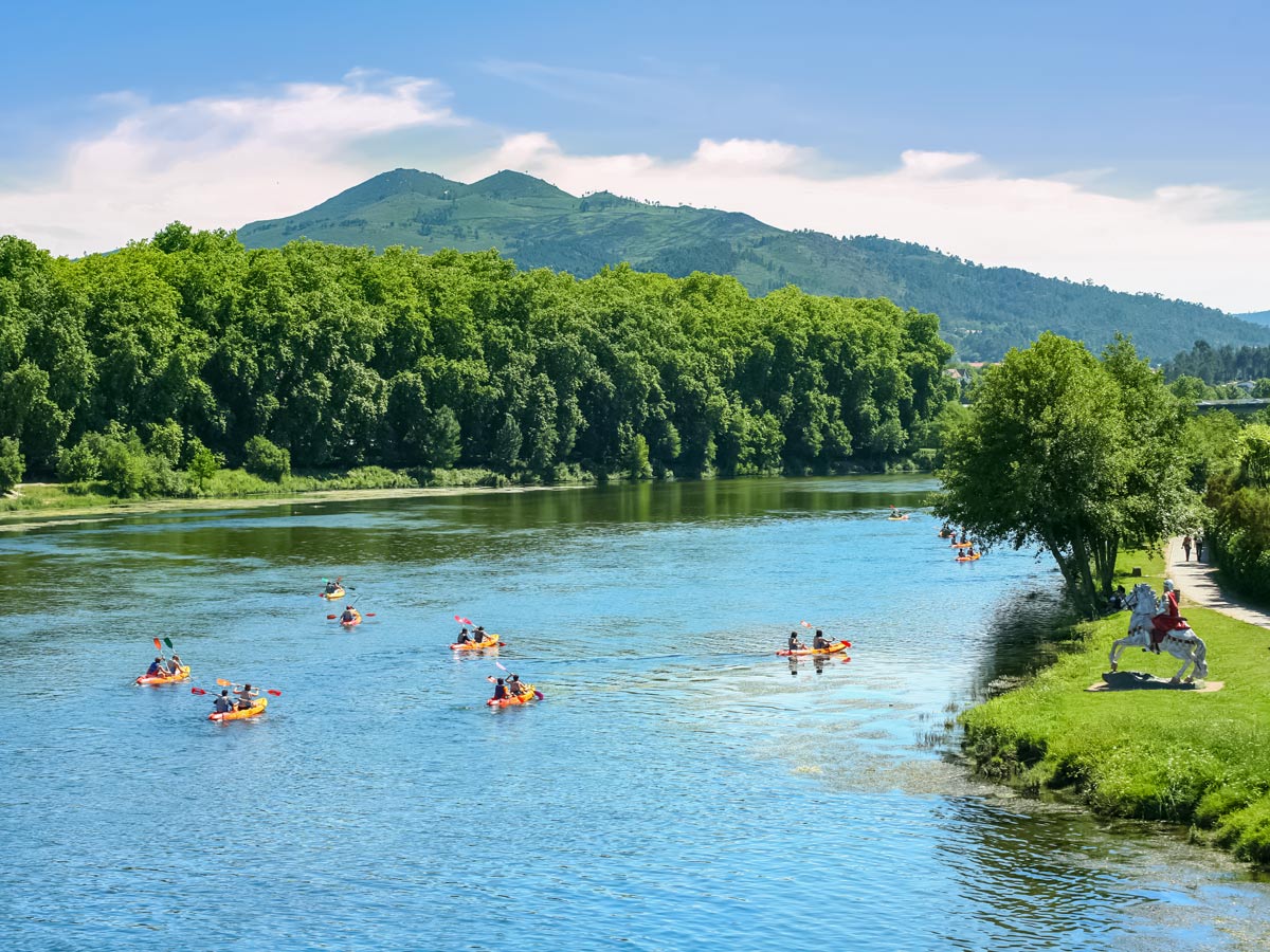 Kayaking river channel adventure family bike tour Minho Portugal