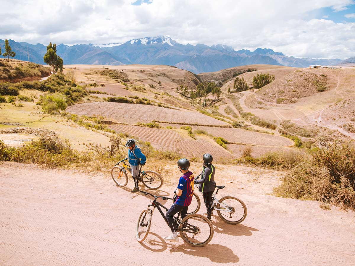 Three bikers cycling ebikes in Sacred Valley