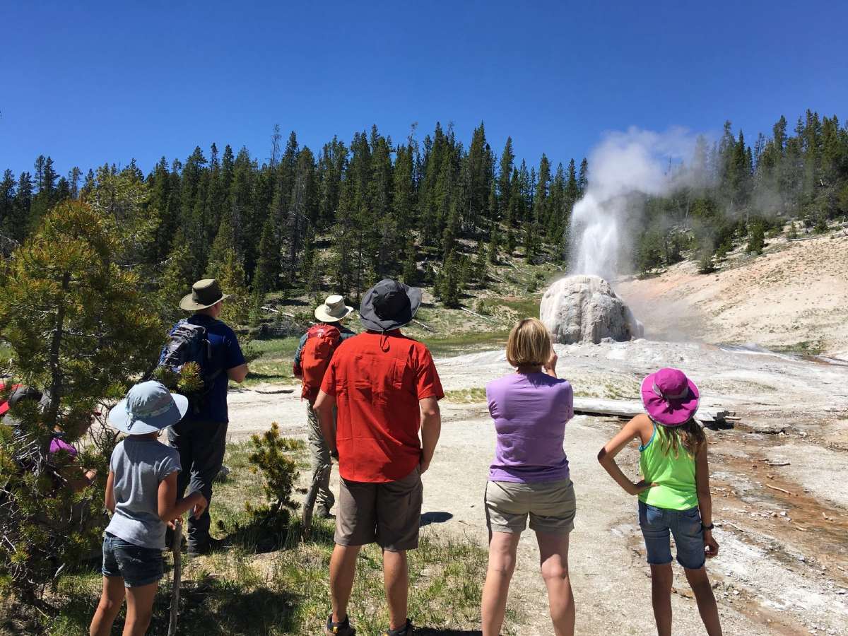 Family in Yellowstone looking at geysers