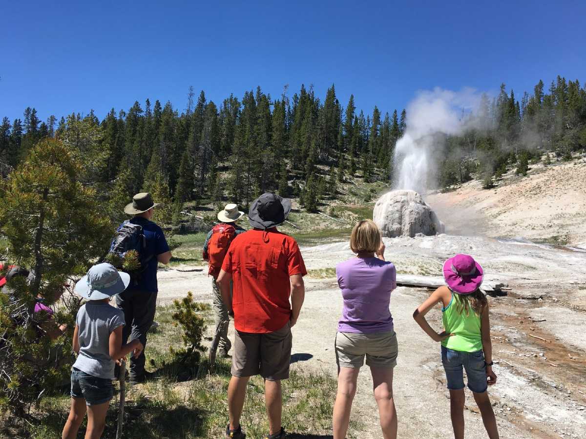 Family enjoying the geyser views in Yellowstone