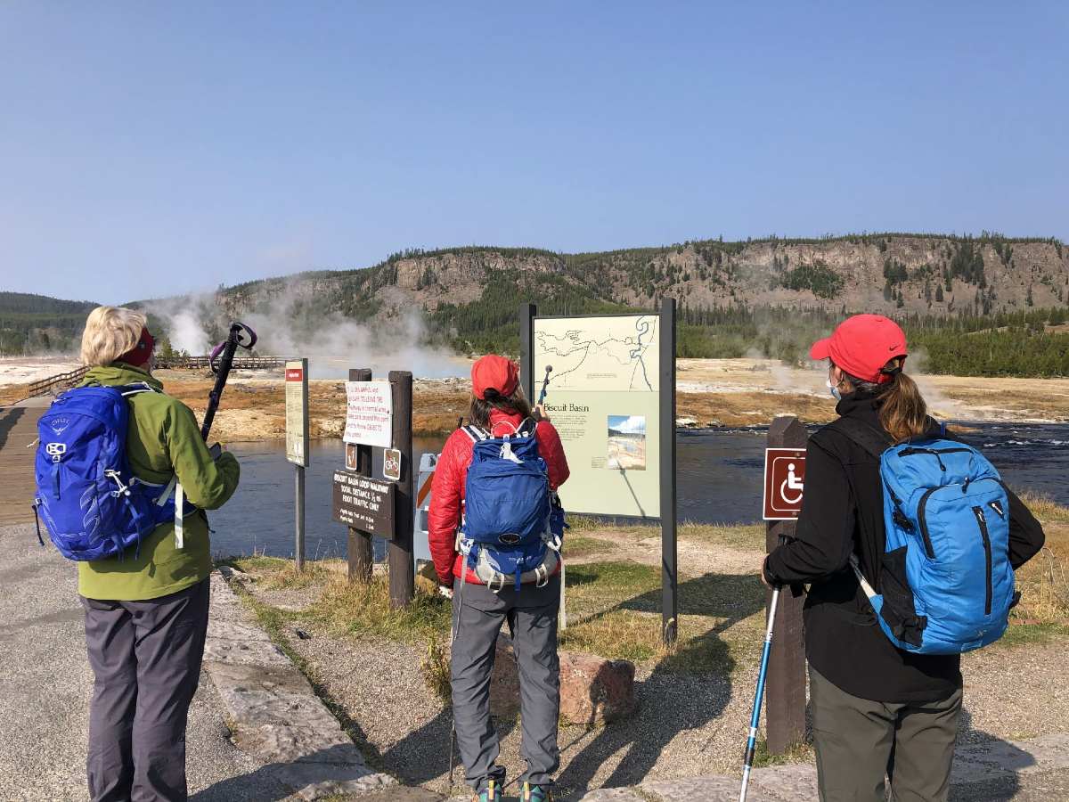 Group of walkers checking the signs out at Yellowstone