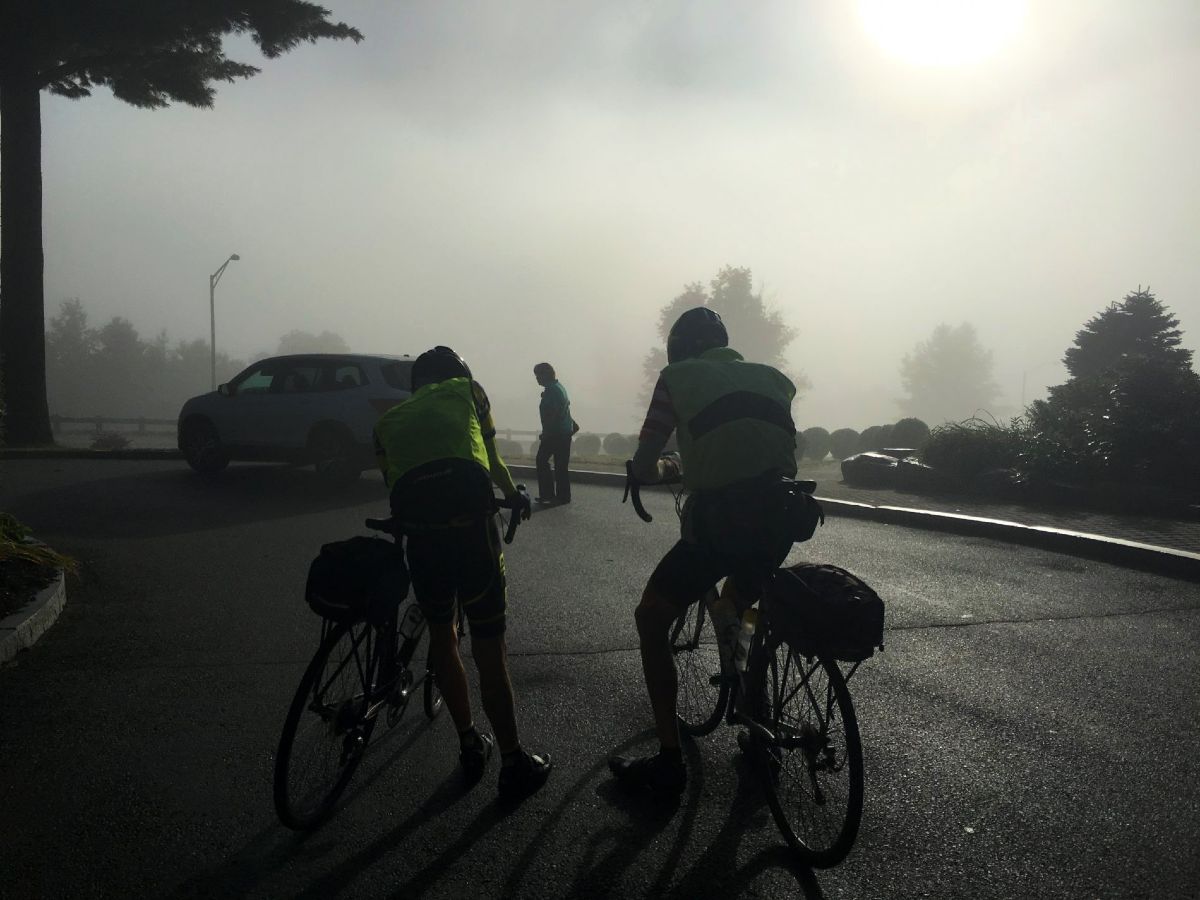 Two bikers in a fog on Adirondack Cycling Tour