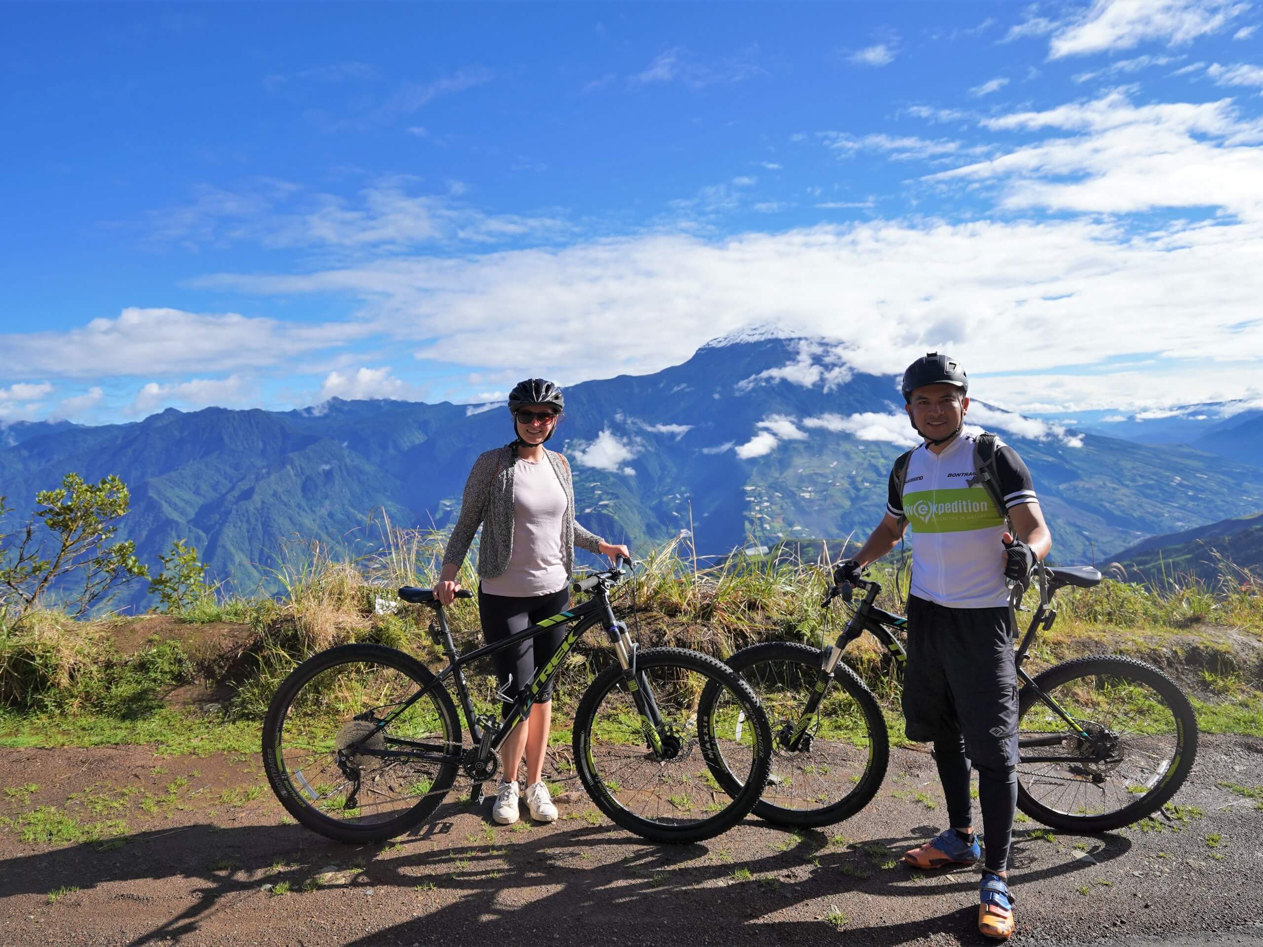 Cyclists posing in front of the stunning mountains in Ecuador