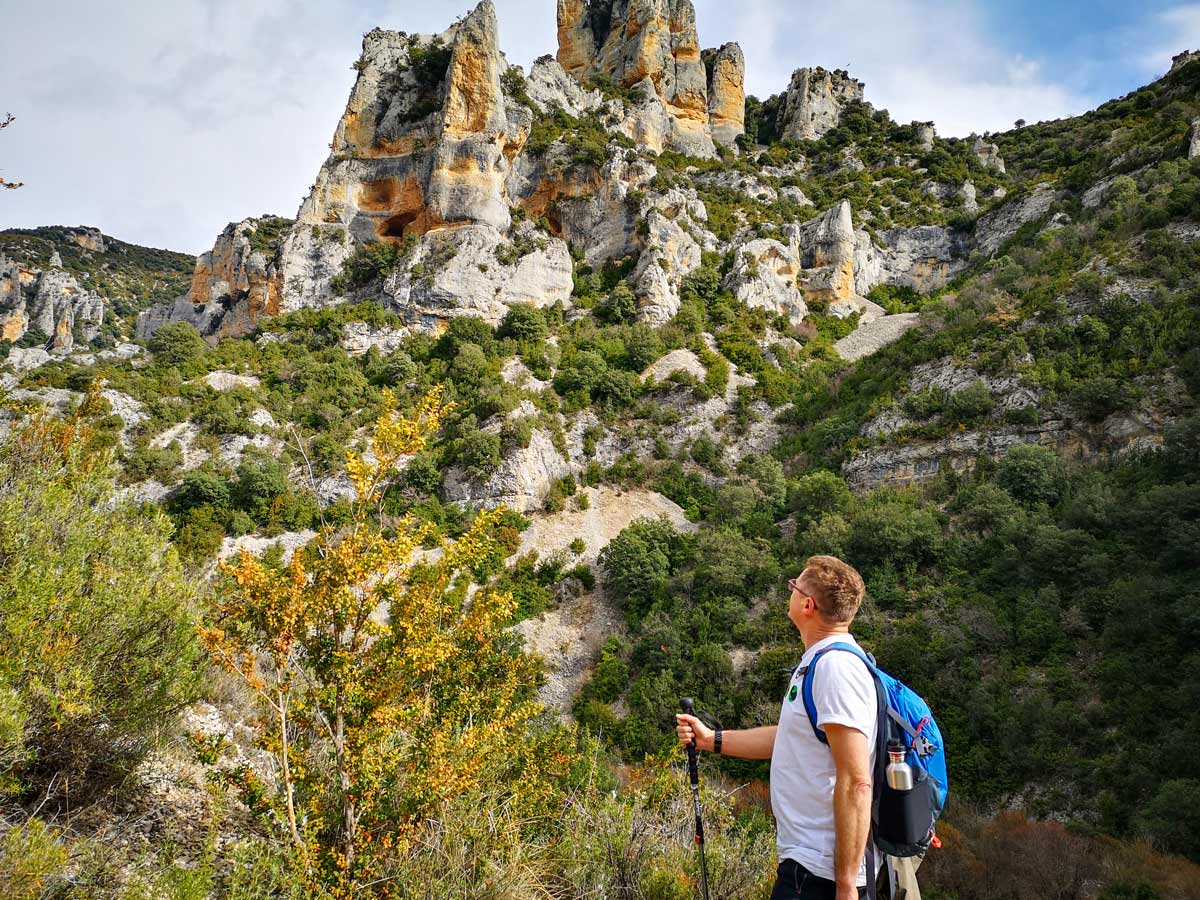 Hiker explores aragon sierra de guara rocky terrain Spain