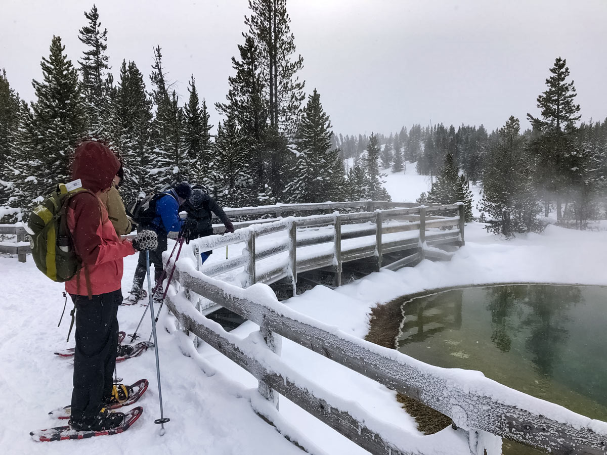 Yellowstone snow MorningGlory Pool snowshoe adventure tour Yellowstone National Park USA