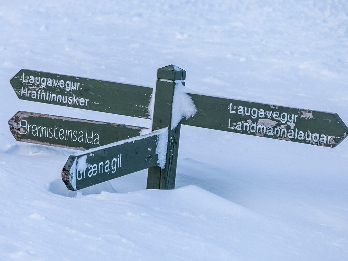 Signpost burried in deep snow Landmannalaugar cross country nordic ski adventure trek
