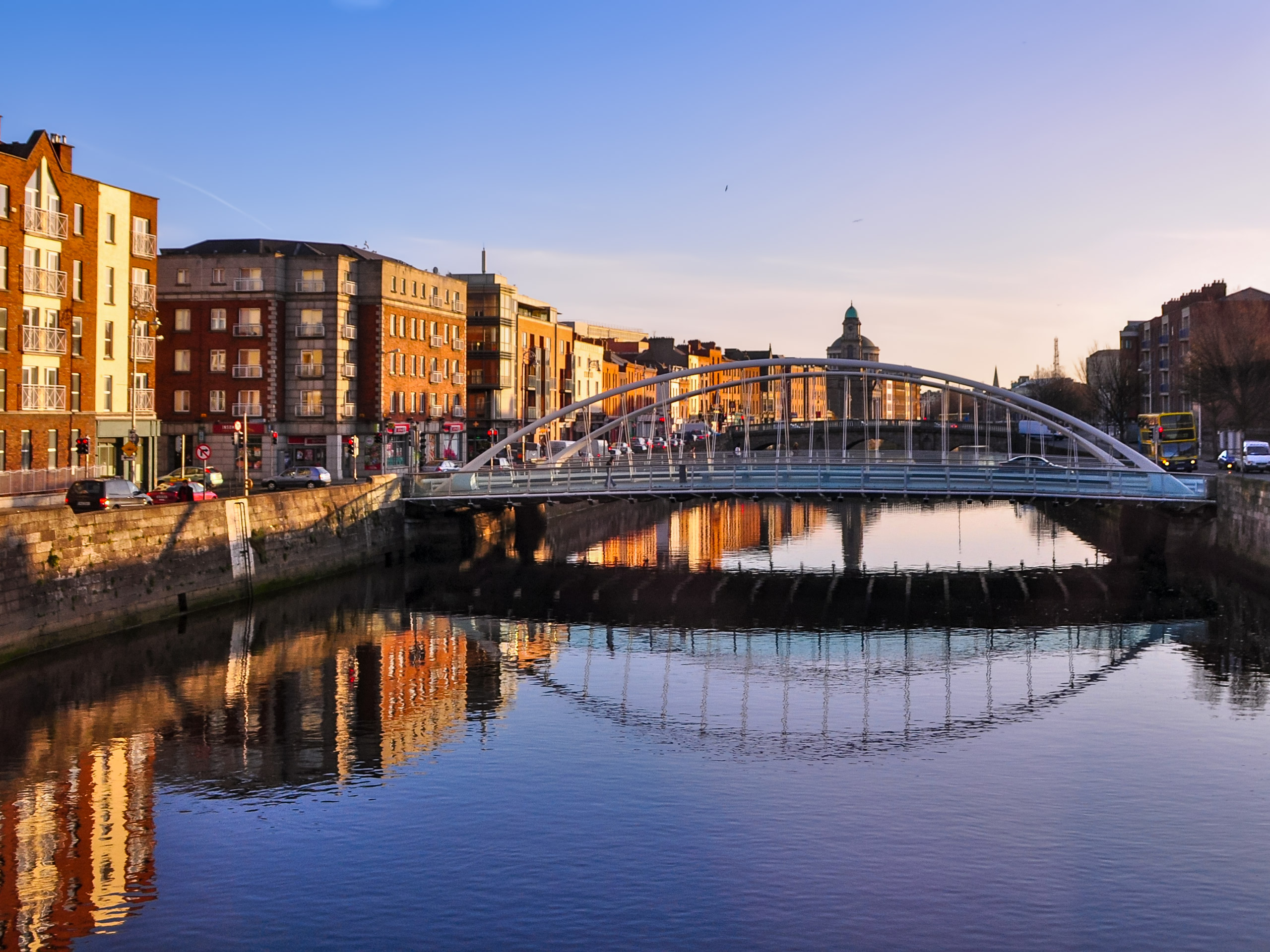 Bridge crossing river through the city in Dublin Ireland