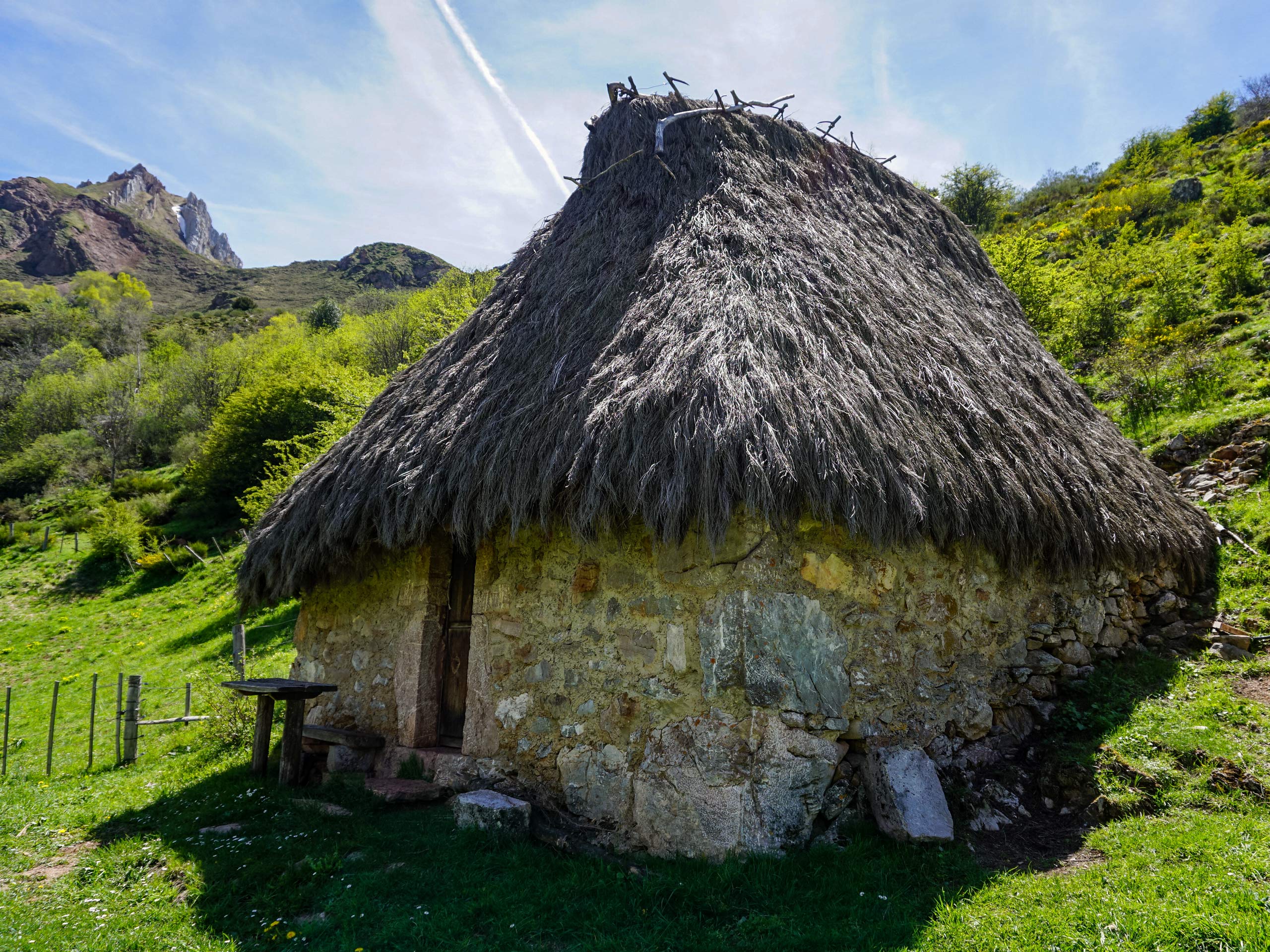 Circular stone hut with grass roof circular lagos hiking in Spain Asturias walking circular lagos