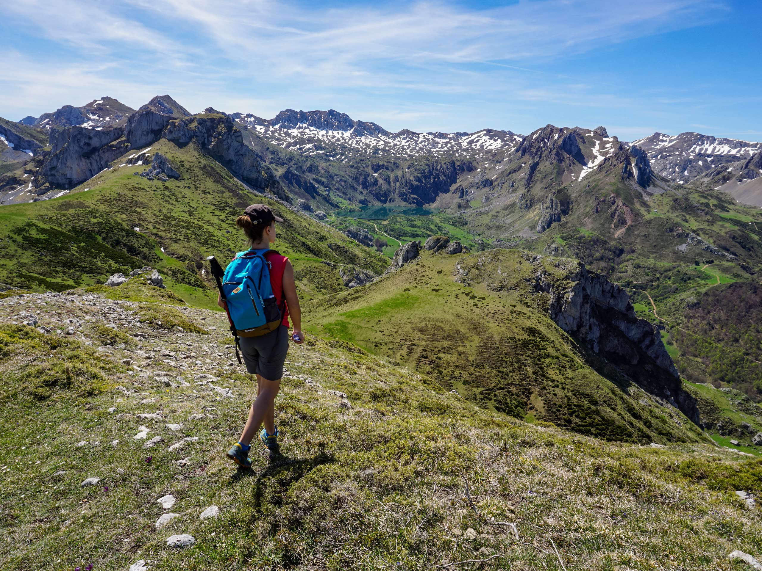 Hiker admiring Spanish mountain range Asturias walking circular lagos