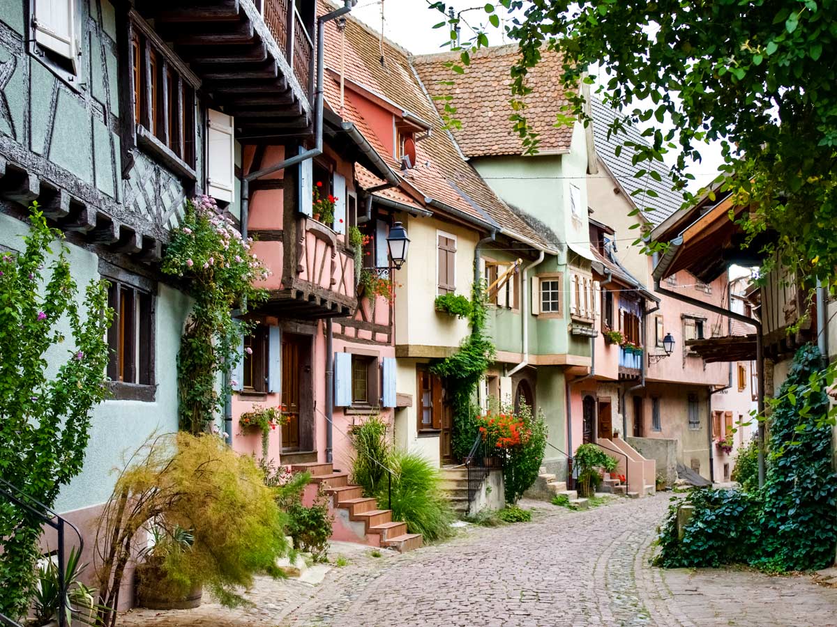 Exploring quaint French villages and cobblestone street exploring wine route Alsace France