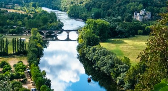 Beautiful countryside of Dordogne France Chateaus river bridge