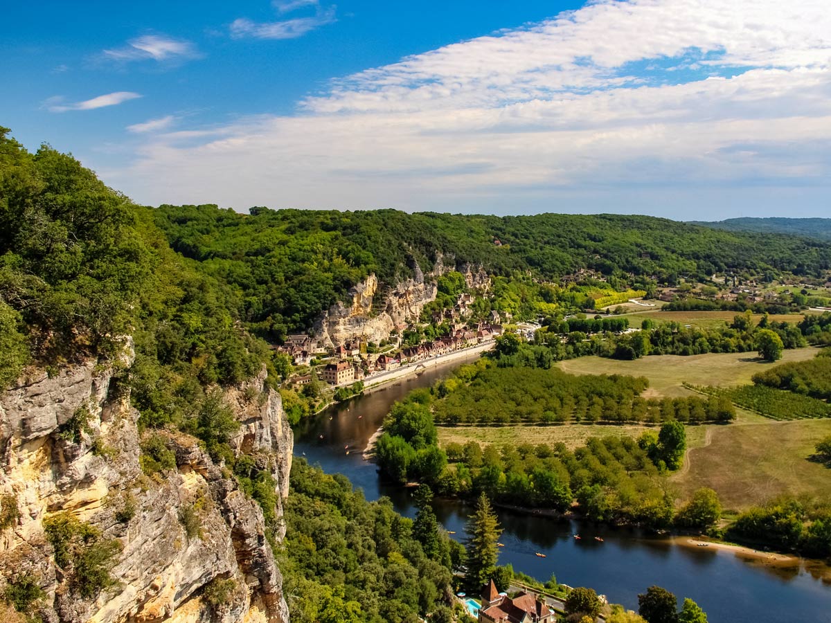 La Dordogne village along meandering river and cliffs exploring France