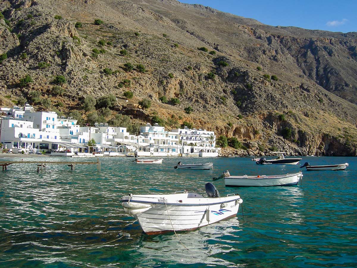 boats harbour aqua water Crete Greece coastline adventure tour