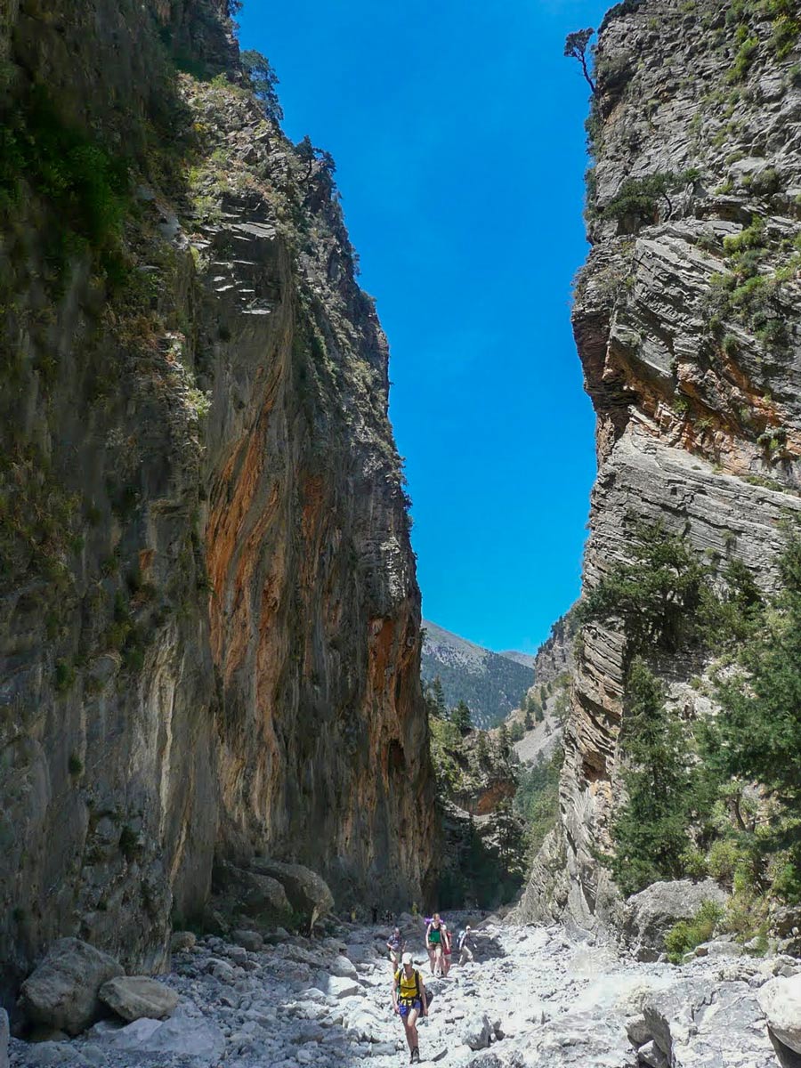 Hiking through canyon gorge Samaria Crete Greece west adventure walking tour
