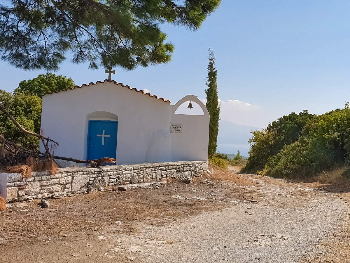 Hilltop mountain church above Mediterranean sea walking Samos Island Greece